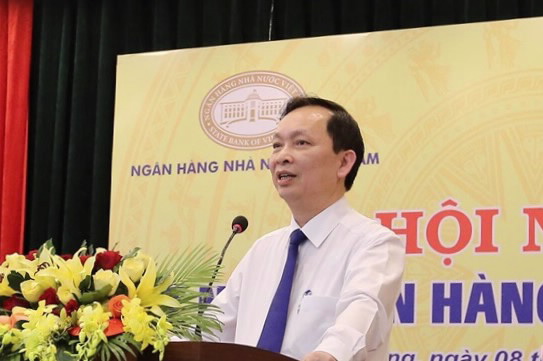 Deputy Governor Dao Minh Tu speaks at the Conference